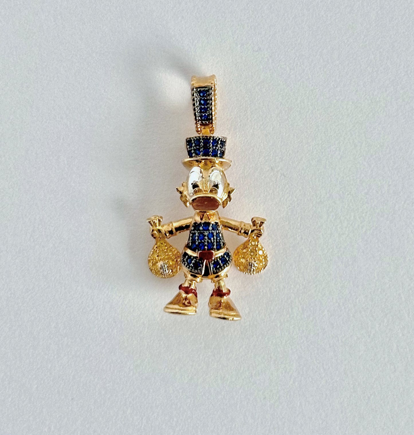 Dije Tío Rico en Oro 18k y Circones