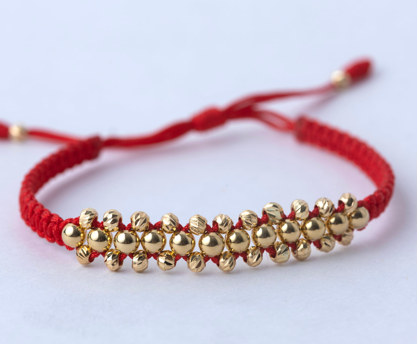 Pulso Tejido Tres Carriles Roja Oro 18k