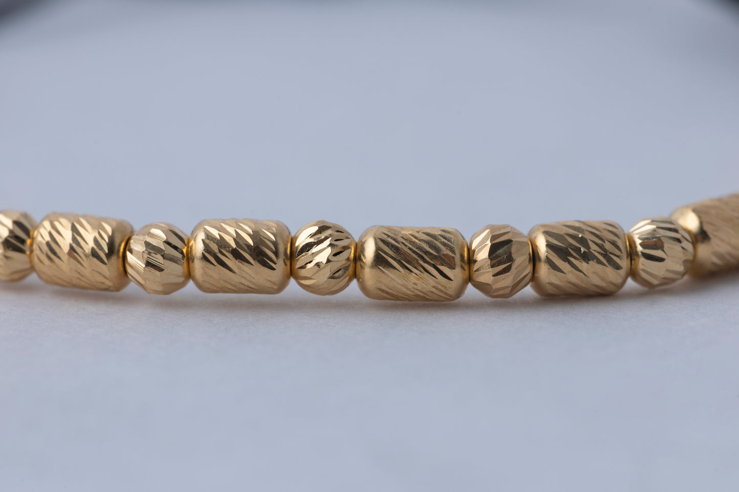 Pulso Tejido balin y barril  Oro 18K